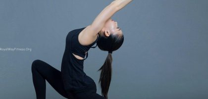 woman in black tank top and black pants doing yoga